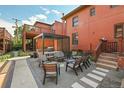Outdoor patio area with a pergola, grill, and seating, perfect for entertaining guests in style at 3132 Umatilla St # B, Denver, CO 80211