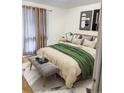 Cozy bedroom with a comfortable bed, soft bedding, and ample natural light at 6495 E Happy Canyon Rd # 79, Denver, CO 80237