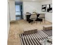 Modern dining area featuring a sleek table, stylish chairs, and contemporary decor at 6495 E Happy Canyon Rd # 79, Denver, CO 80237