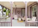 Relaxing porch setting with cozy seating, vintage decor, and covered space at 715 Main St, Georgetown, CO 80444