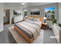 Serene main bedroom featuring soft natural light, carpet, and stylish decor at 16453 E Phillips Dr, Englewood, CO 80112