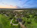 Aerial view of property featuring lush greenery and a long private driveway at 5602 Silver Bluff Ct, Parker, CO 80134
