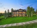 Beautiful home featuring a spacious porch and a sidewalk extending to the side of the property at 5602 Silver Bluff Ct, Parker, CO 80134
