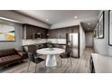 Well-designed kitchen featuring stainless steel appliances, dark cabinets, and modern finishes at 1643 Boulder St # 209, Denver, CO 80211