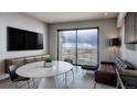 Inviting living room with a large window, city views, and a contemporary seating area at 1643 Boulder St # 209, Denver, CO 80211
