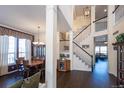 Elegant dining room with hardwood floors, chandelier, and large window provides ample light at 3259 W 111Th Drive, Westminster, CO 80031