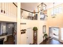 Grand entryway with high ceilings, staircase, and natural light pouring in from large windows at 3259 W 111Th Drive, Westminster, CO 80031