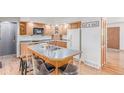 Bright kitchen with a center island, stainless steel appliances, and modern countertops at 5070 W 66Th Ave, Arvada, CO 80003