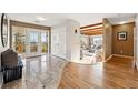 Welcoming foyer with tile flooring, a decorative front door, closet, and an open view into the living area at 8090 Newton St, Westminster, CO 80031