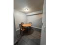 Cozy dining area featuring a round table with four chairs, perfect for intimate meals and gatherings at 10785 W 63Rd Pl # 105, Arvada, CO 80004
