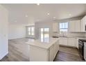 Open concept kitchen, quartz countertops and stainless steel appliances with an eat-in kitchen at 5581 Inland Ave, Firestone, CO 80504