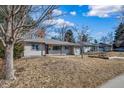 Charming single-story home with mature trees in a quiet neighborhood and an attached one-car garage at 3000 S Jackson St, Denver, CO 80210