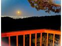Beautiful night scene of city lights and starry skies seen from the residence's exterior at 21849 Cabrini Blvd, Golden, CO 80401