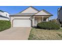 Lovely single-Gathering home with a well-maintained lawn, two car garage and inviting entrance at 20451 Kelly Pl, Denver, CO 80249