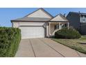 Single-Gathering home with a well-maintained lawn, two car garage and inviting entrance at 20451 Kelly Pl, Denver, CO 80249