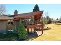 Beautiful home featuring a balcony with striking architectural detail and mature trees at 40 Charlou Cir, Cherry Hills Village, CO 80111