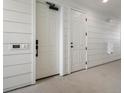 Bright hallway with white walls and doors leading to various rooms at 6153 N Ceylon St # 201, Denver, CO 80249