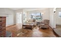 Cozy living room with lots of natural light, and an open concept living space at 4731 S Acoma St, Englewood, CO 80110