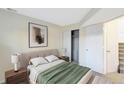 Comfortable bedroom featuring neutral tones, a closet, and carpeted floors at 17325 E Rice Cir # F, Aurora, CO 80015
