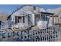 Front view of a charming white house at 939 Knox Ct, Denver, CO 80204