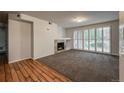 Spacious living room features plush carpet, fireplace, and shutters at 804 Summer Hawk Dr # 5105, Longmont, CO 80504