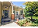 Inviting front porch with a cozy seating area, perfect for enjoying the outdoors and curb appeal at 16084 Stonebriar Dr, Parker, CO 80134