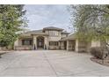 A sprawling single-story home with a circular driveway and an attached multi-car garage at 2035 Buchanan Pt, Lafayette, CO 80026