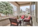 Cozy covered patio with comfortable seating and views of the surrounding neighborhood at 2035 Buchanan Pt, Lafayette, CO 80026