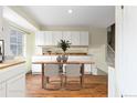 The dining room area features hardwood floors and a large window offering a view at 2888 S Fundy St, Aurora, CO 80013