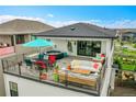 This fantastic rooftop deck has multiple seating areas and a hot tub at 21345 E 59Th Dr, Aurora, CO 80019