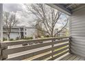 Balcony view of complex buildings and parking lot at 3141 S Tamarac Dr # 202E, Denver, CO 80231