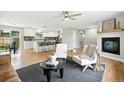 Open-concept living room and kitchen with hardwood floors and lots of natural light at 10320 W 35Th Ave, Wheat Ridge, CO 80033