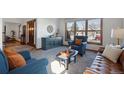 Cozy living room featuring plush seating, neutral decor, and abundant natural light creating a relaxing atmosphere at 16234 E Belleview Dr, Centennial, CO 80015