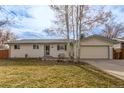 House exterior featuring a landscaped lawn and driveway at 3460 W 131St Ave, Broomfield, CO 80020