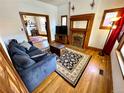Cozy living room with a fireplace, plush sofa, and stylish area rug at 52 S Washington St, Denver, CO 80209