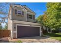 Charming two-story home featuring a spacious two-car garage and well-maintained landscaping at 1624 Westin Dr, Erie, CO 80516