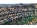 Aerial view of the community with mountain views, the Red Hawk Golf Course, trails, and a convenient location at 2198 Broadleaf Loop, Castle Rock, CO 80109