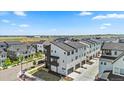 A neighborhood featuring modern townhomes with a view of open land in the distance at 16637 Shoshone St, Broomfield, CO 80023