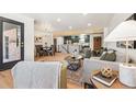 Bright living room with hardwood floors, modern furniture, and a large window at 725 S Harrison St, Denver, CO 80209