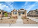 Inviting brick home exterior with landscaped front yard and walkway at 1578 N Meade N St, Denver, CO 80204