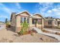 Charming brick home with mature trees and gravel landscaping at 1578 N Meade N St, Denver, CO 80204