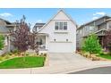 Attractive two-story house with a well-maintained lawn and a driveway leading to a two-car garage at 2027 Vallejo Loop, Broomfield, CO 80023