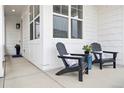 Cozy front porch with seating, perfect for relaxing and enjoying the outdoor ambiance of this home at 2027 Vallejo Loop, Broomfield, CO 80023