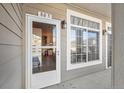 Welcoming front entrance with glass door and view of a bright interior. Natural light streams through a side window at 10050 E Gunnison Pl # 805, Aurora, CO 80247