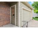 Exterior of the home with brick accents, a two car garage, and visible house numbers at 14333 E Warren Pl, Aurora, CO 80014