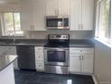 Well-appointed kitchen featuring stainless steel appliances and ample counter space at 1326 S Canosa Ct, Denver, CO 80219