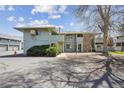 A look at the townhome complex featuring a manicured landscape at 1112 Elysian Field Dr # E, Lafayette, CO 80026