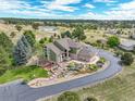 Spacious house with a large yard and mountain views in the background at 4812 Moonshine Ridge Trl, Parker, CO 80134