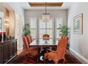 Elegant dining room with a decorative chandelier and seating for eight at 35 Brookhaven Pl, Littleton, CO 80123