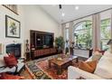 Cozy living room featuring a fireplace, large window and a beautiful rug at 35 Brookhaven Pl, Littleton, CO 80123